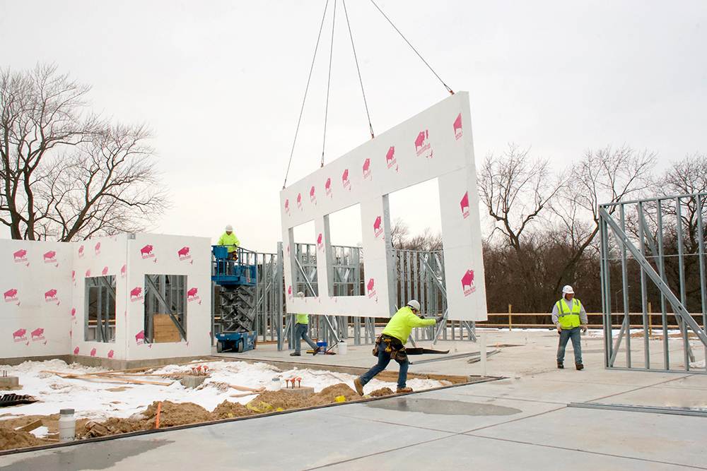 setting exterior load bearing wall panels into place